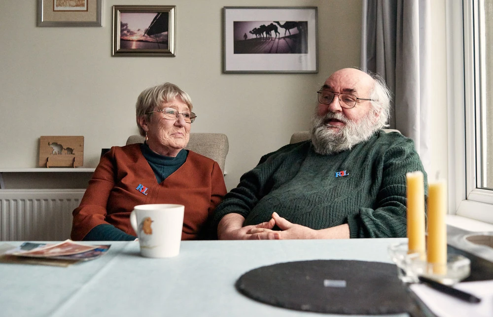 Dorothy and Angus Weir sat at home