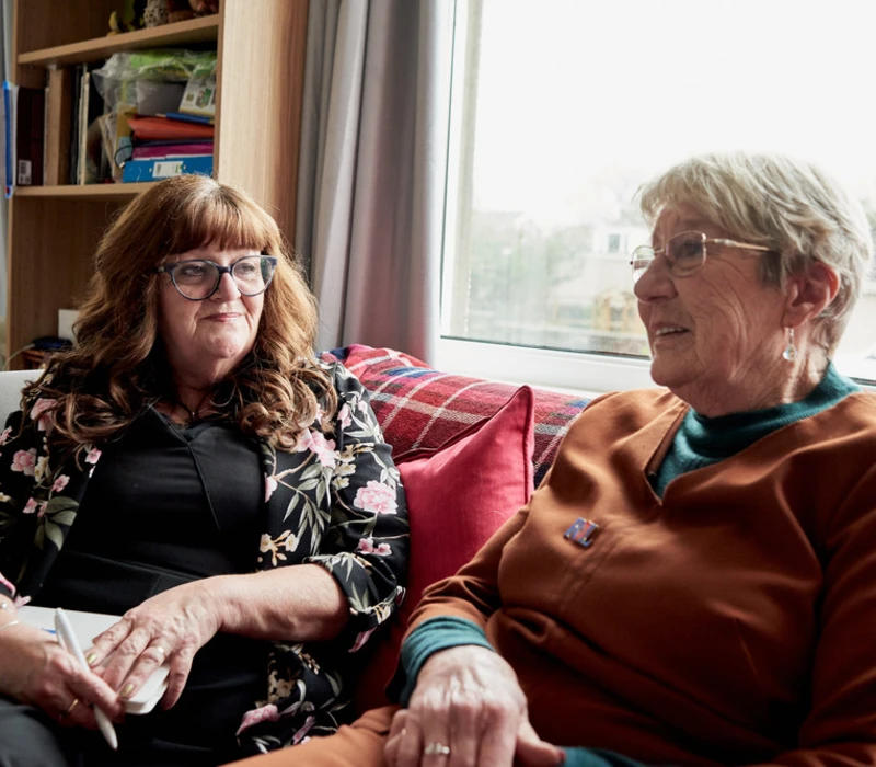 Dorothy Weir and Admiral Nurse Helen Buckley sat on sofa Dorothy Weir and Admiral Nurse Helen Buckley sat on sofa