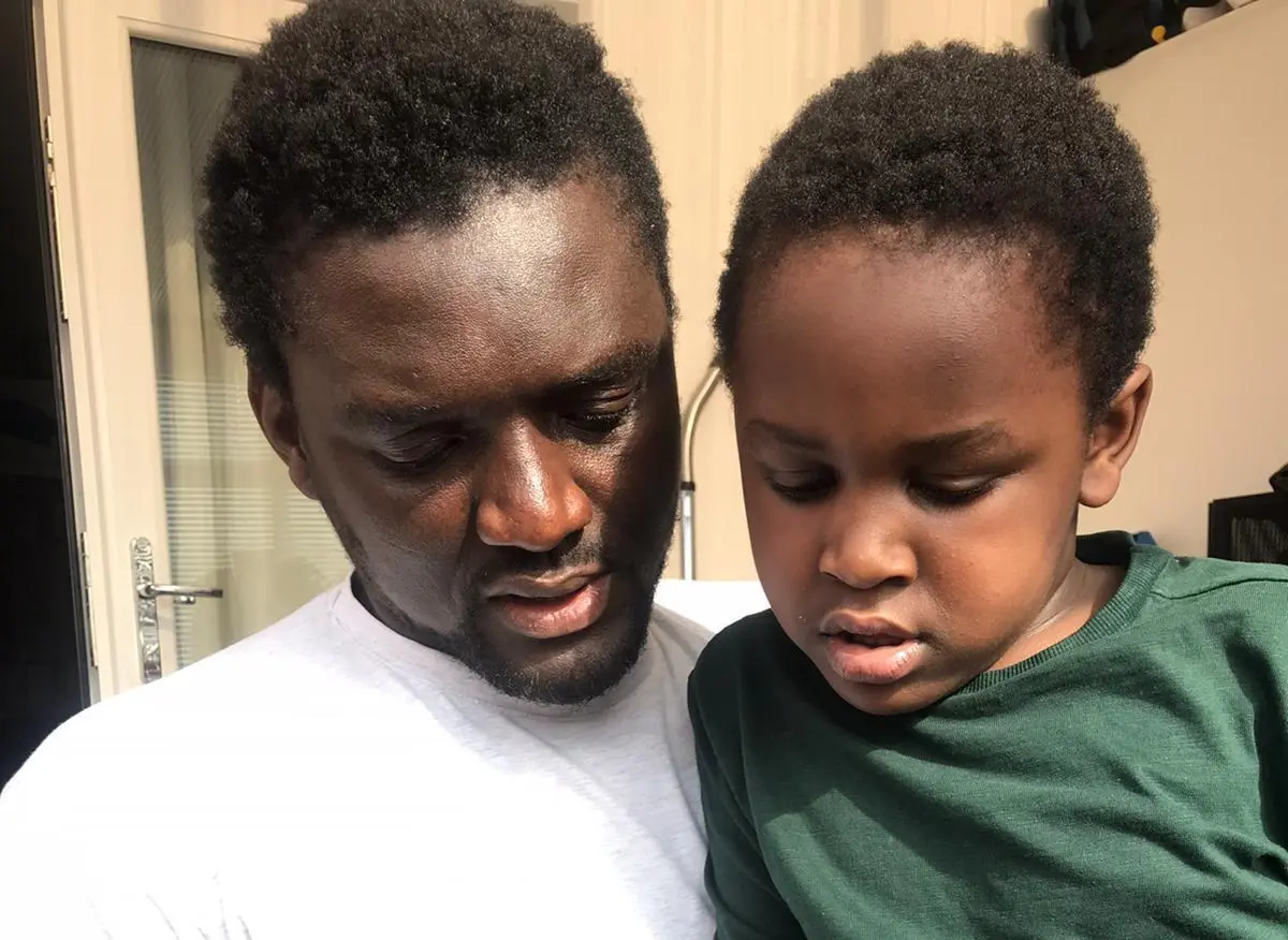 Emmanuel with his son Chissey