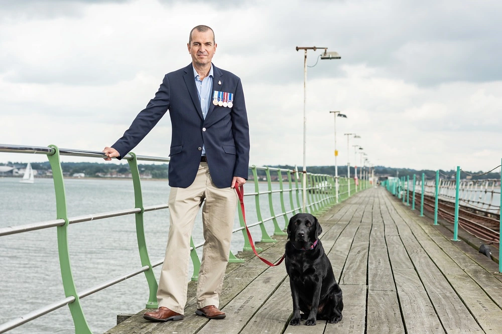 Charlie on pier with dog
