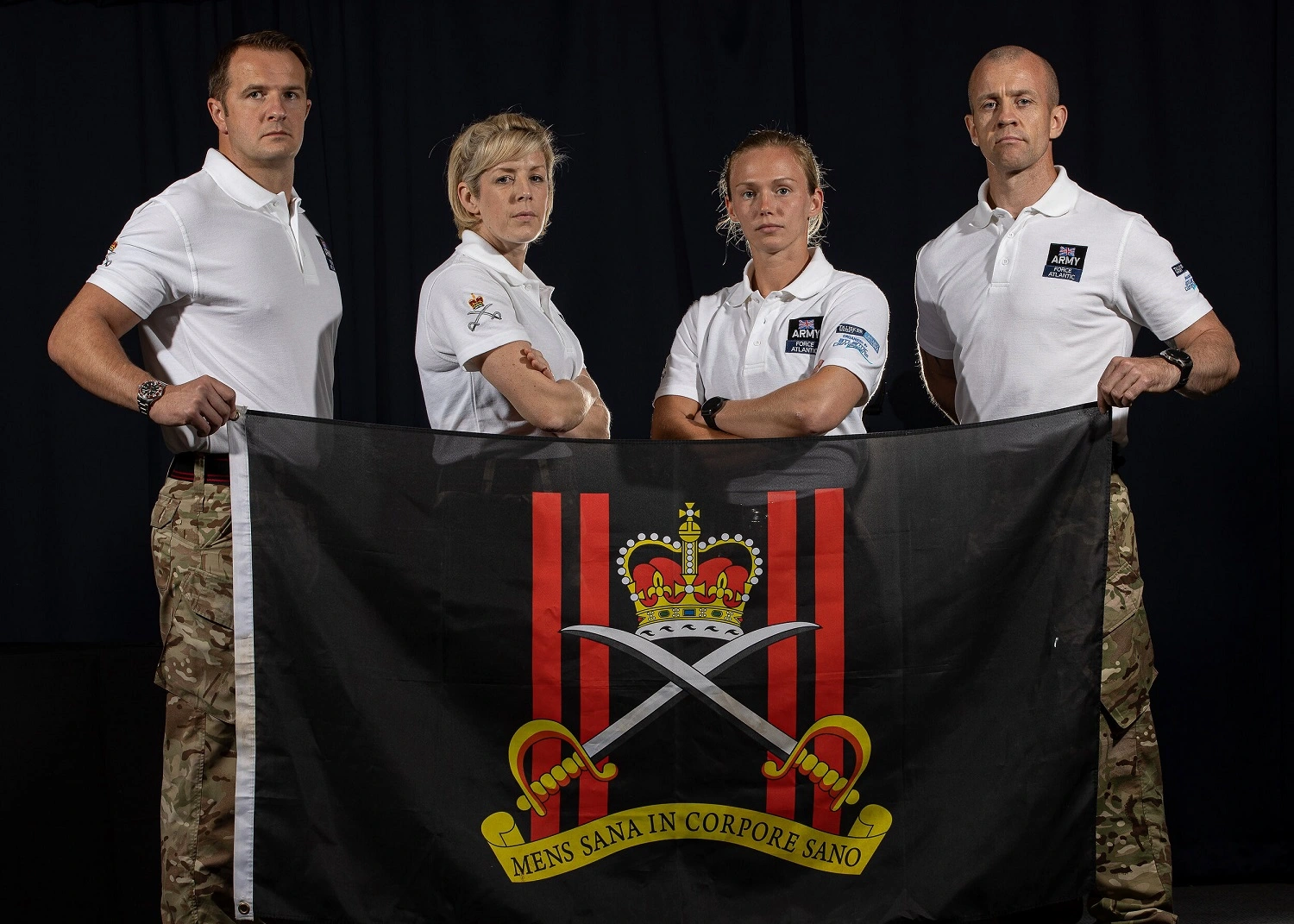 Force Atlantic team holding Army flag