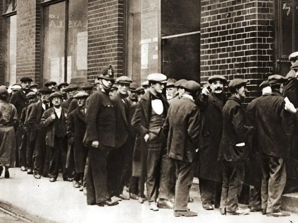 A queue of unemployed men waiting to sign on after the war