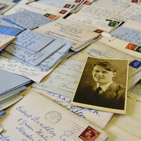 gordon_gilbert_hero Gilbert Bradley photo with his collection of letters