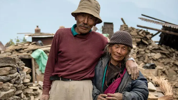 Baldhan and Budhini outside their destroyed home Baldhan and Budhini outside their destroyed home