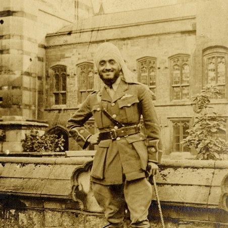 Hardit Singh Malik in the gardens at Balliol, looking toward the Old Library