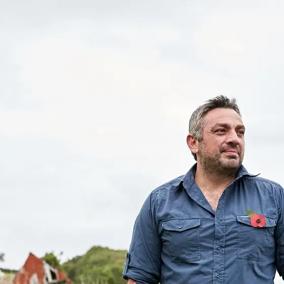 stories_harris_tatakis_newhero Veteran Harris Tatakis pictured in an open field