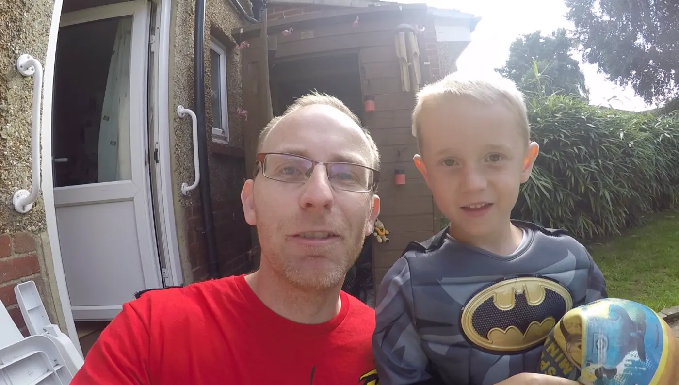 Lee and Noah dressed as superheros in one of their videos