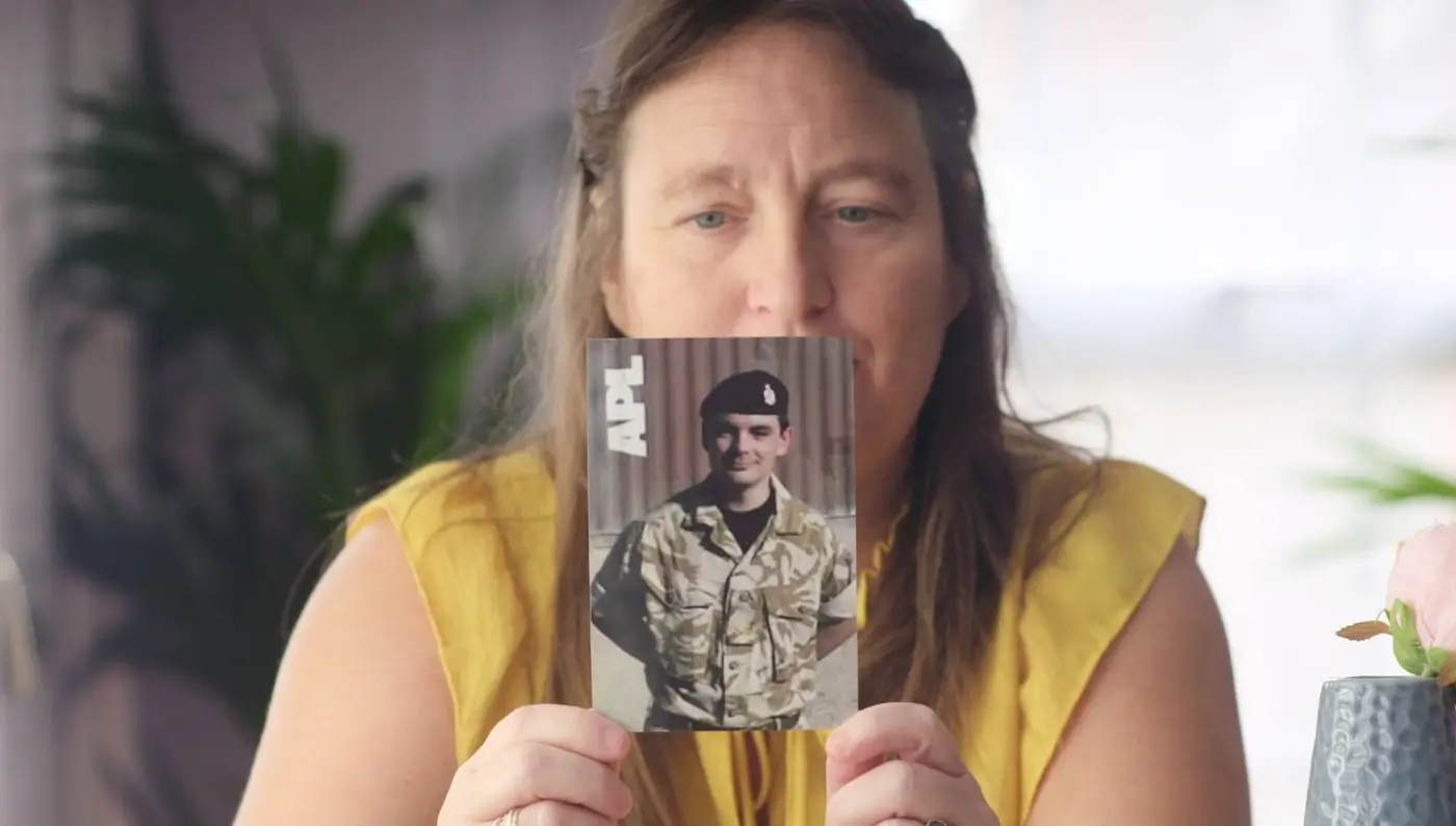 Chantelle holding a picture of her husband