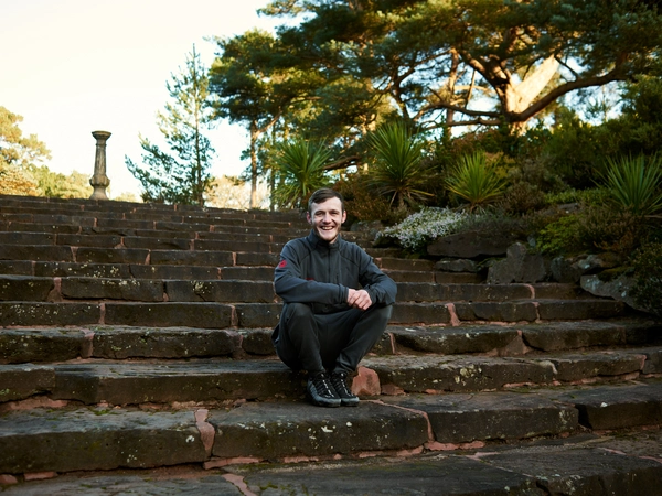 Leon in the hotel grounds Leon sitting on some steps in the hotel grounds