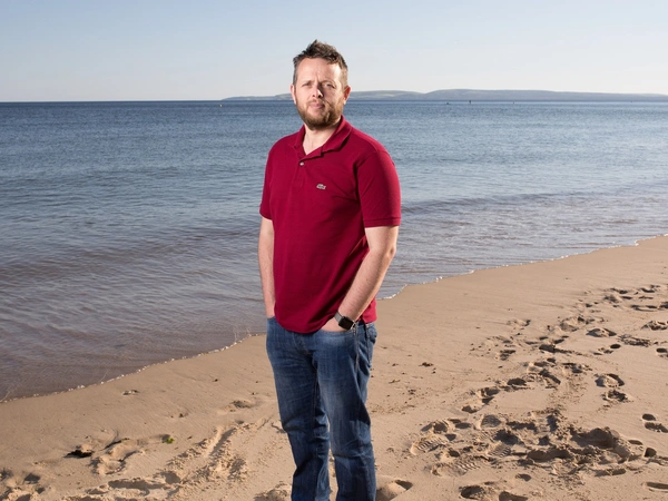 stories_mikekiff_beach Mike Kiff standing on the beach