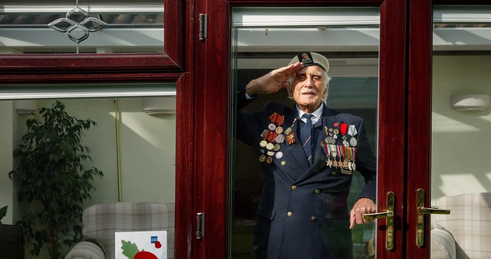 Bill_Taylor_RBL_071-Edit_HR Bill Taylor saluting behind a window