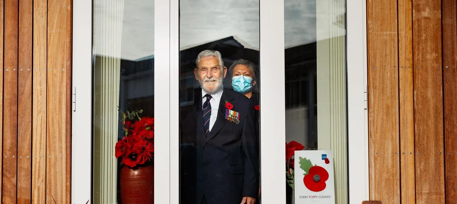 Ken Judd looking out of his front window