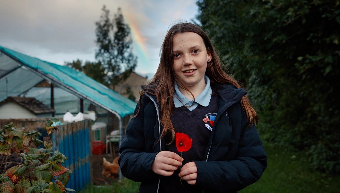 Poppy_Railton_RBL_453-Edit_HR Poppy Railton holding a poppy in her garden