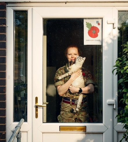 Samantha_Rawlinson_portrait Samantha Rawlinson with poppy poster in window