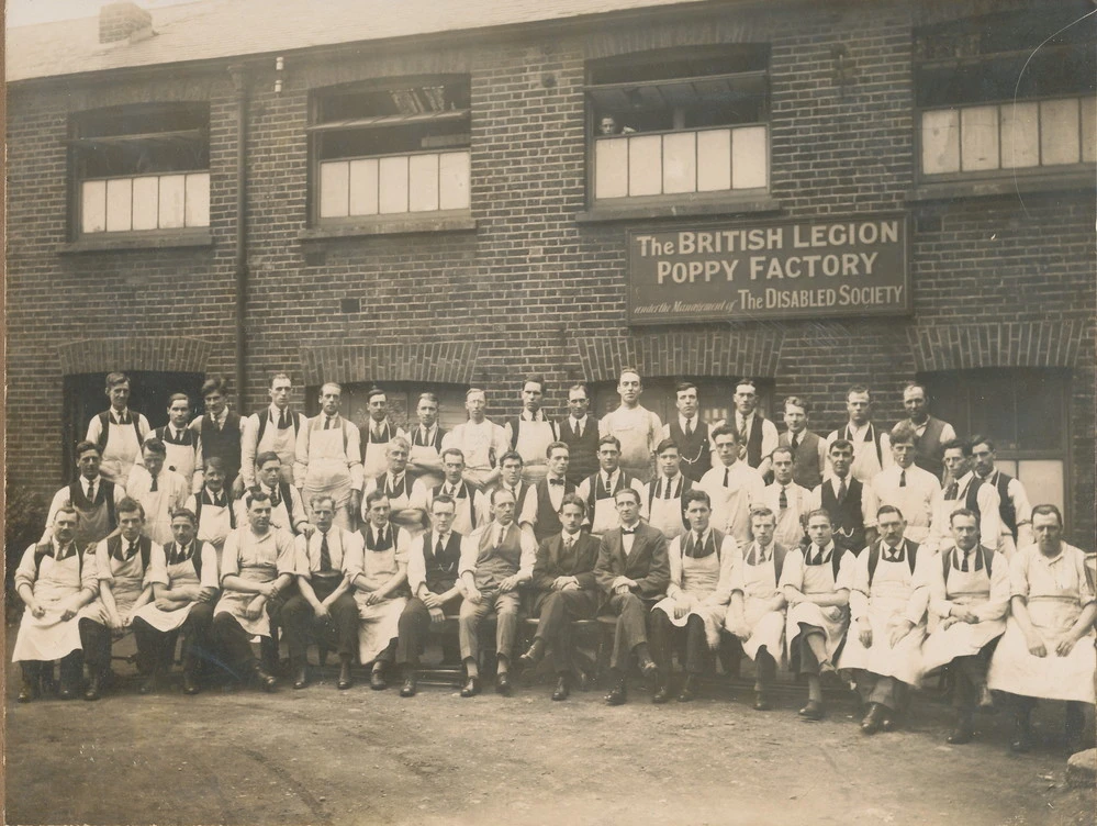 Workers outside the Poppy factory