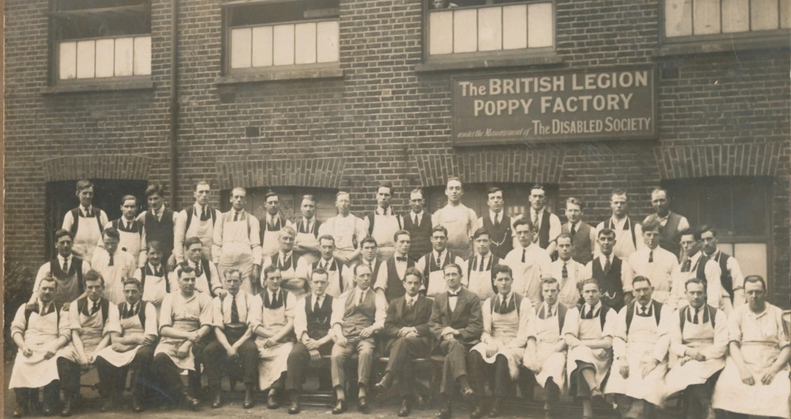 Workers outside the Poppy factory