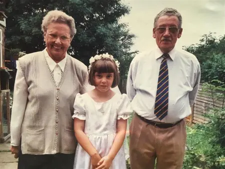 Rachel Hughes with grandparents as a young child.