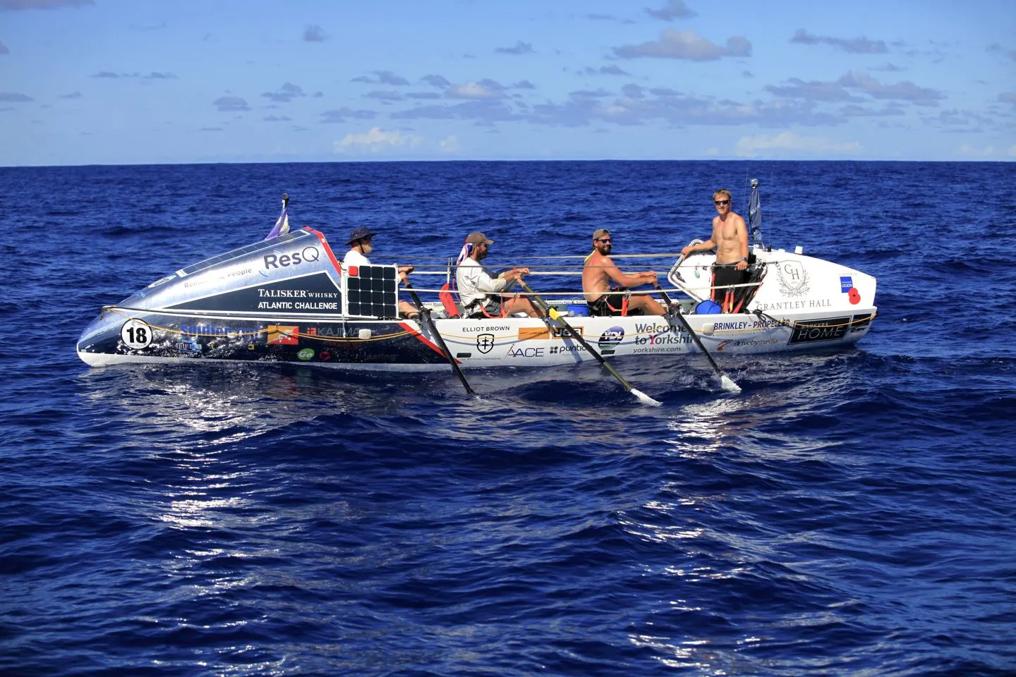 Row 4 Victory team rowing at sea during training