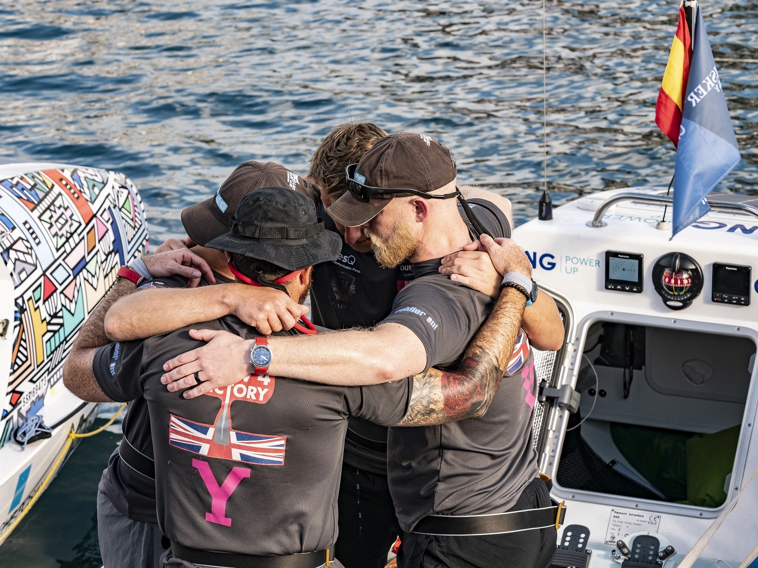 Row 4 Victory team in a team huddle