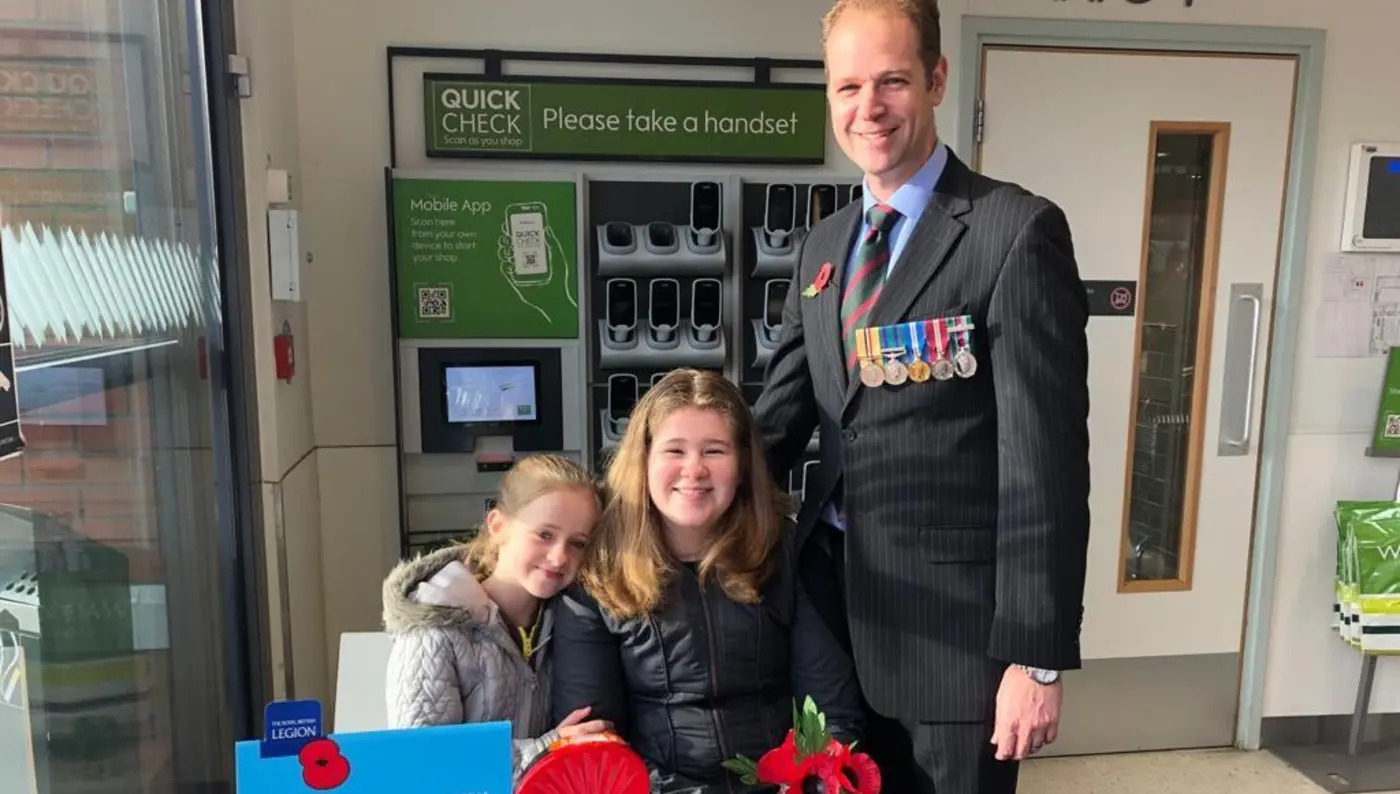 Steve Little collecting for the Poppy Appeal with his family