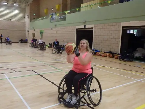 Naomi playing wheelchair basketball