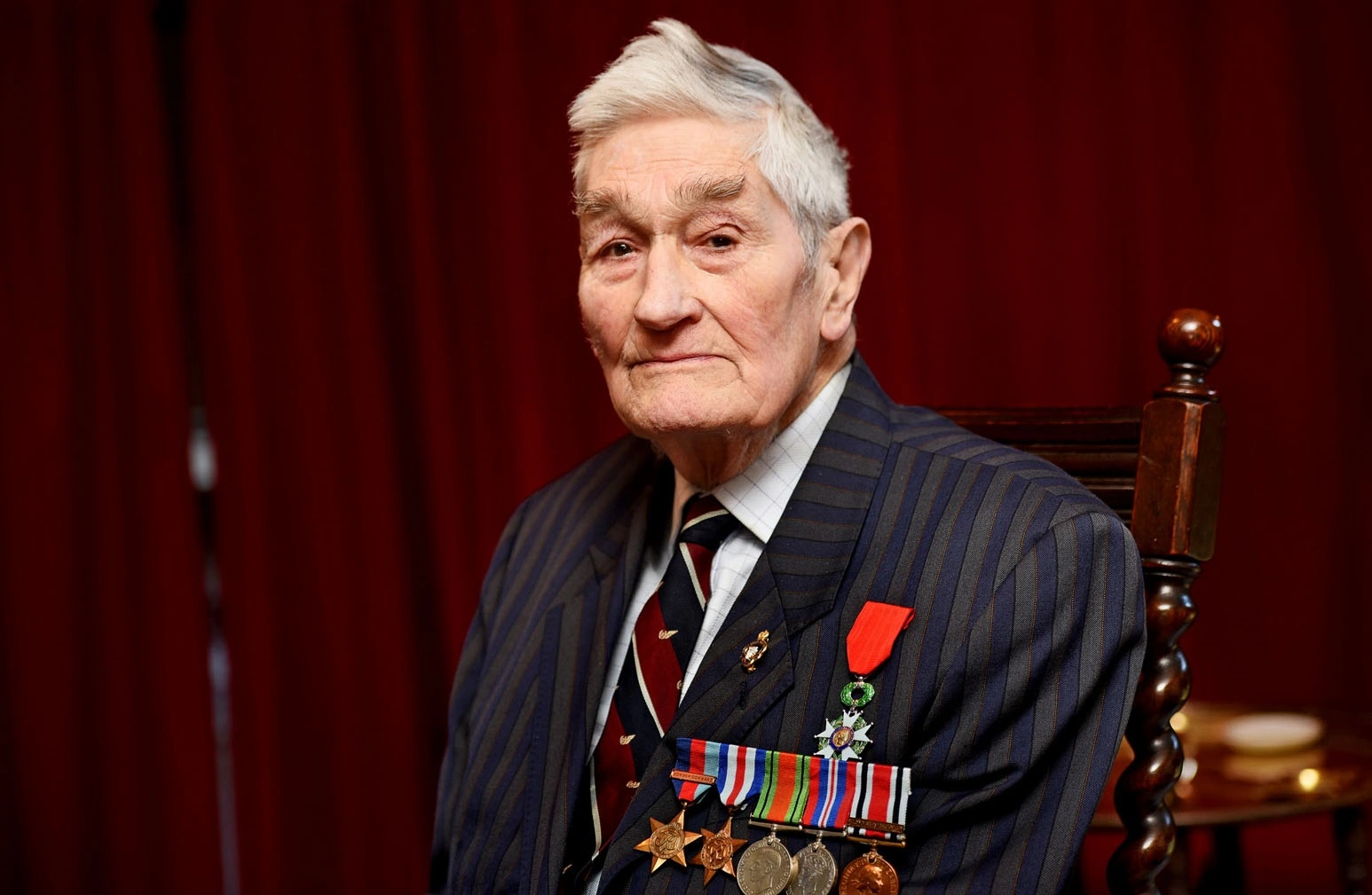 Veteran Desmond Lush donning medals of honour