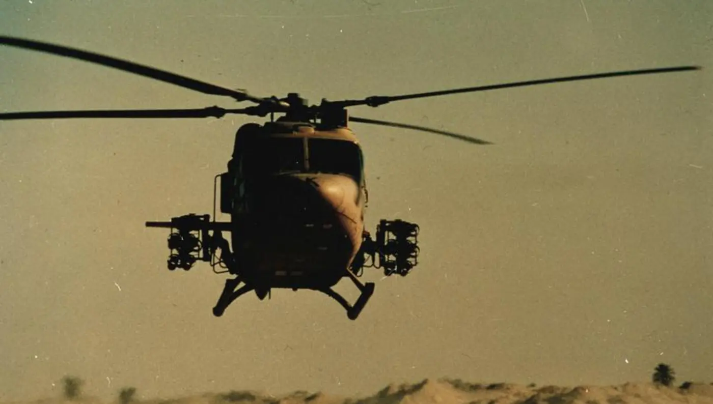 British Army Lynx helicopter lifts off from desert base during Gulf War