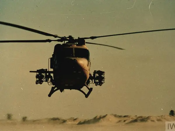 British Army Lynx helicopter lifts off from desert base © IWM British Army Lynx helicopter lifts off from desert base during Gulf War