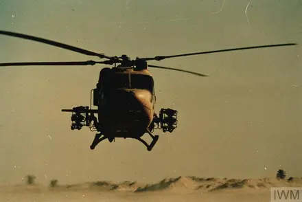 British Army Lynx helicopter lifts off from desert base during Gulf War