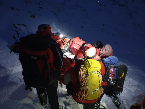 The RAF mountain rescue team helping an injured walker of Mount Snowdon