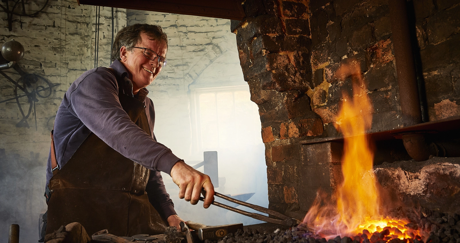 stories_tim_blacksmith_hero Veteran Tim Mackareth in his blacksmith workshop