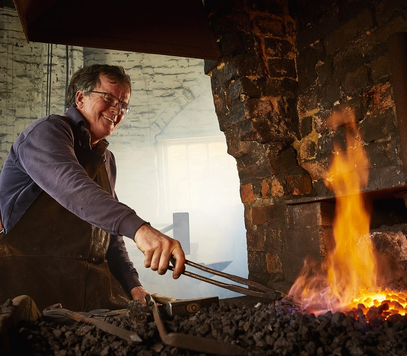 Veteran Tim Mackareth in his blacksmith workshop 