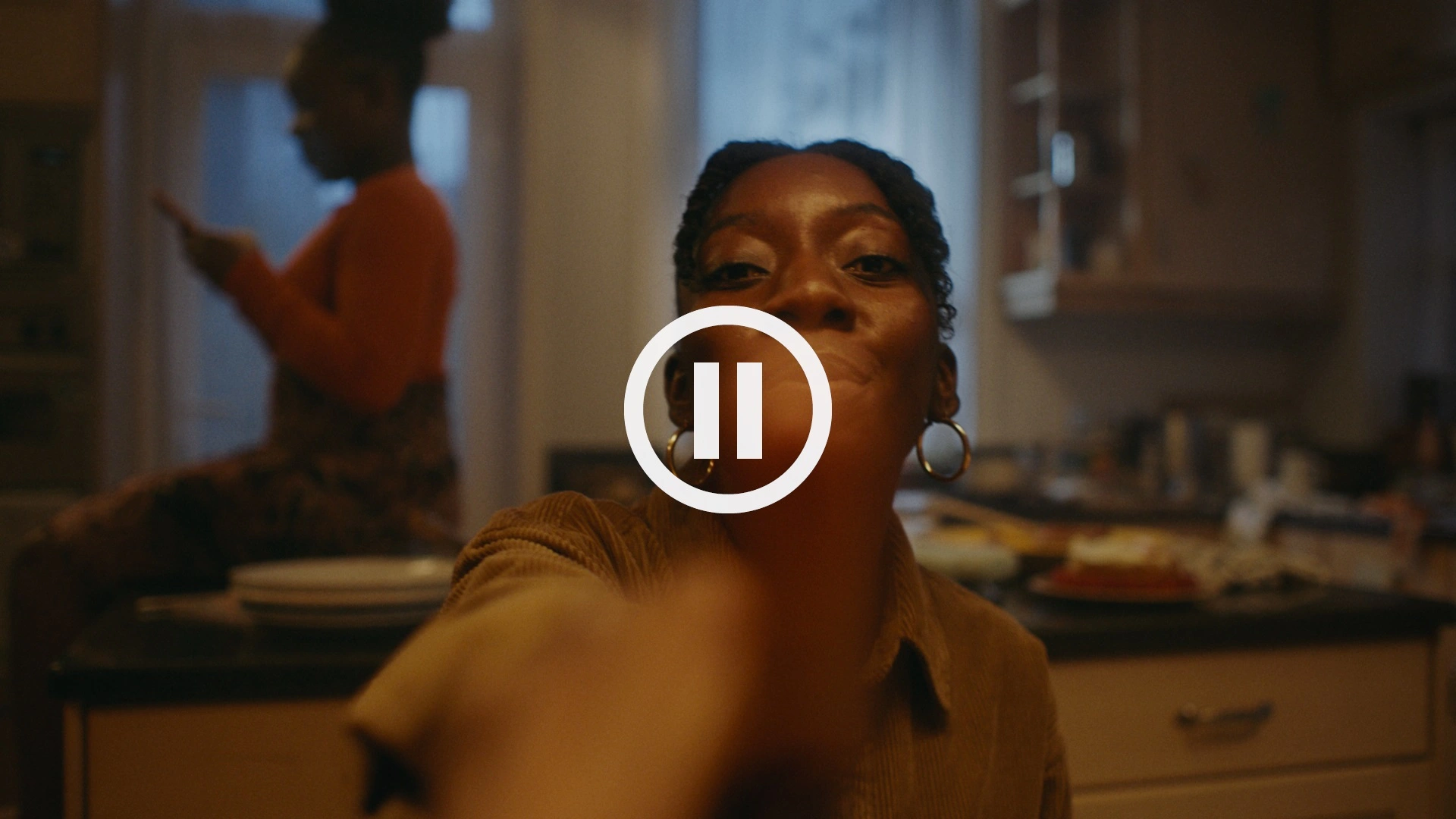 Pause button being pressed