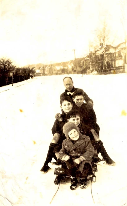Dag Pike on a sled with family