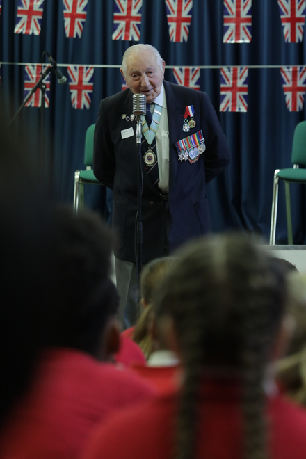 Mervyn speaking at a school