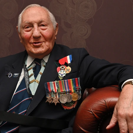 Mervyn wearing his military medals