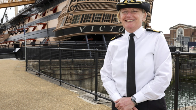 Commodore Terry in front of HMS Victory