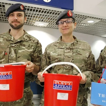 Four serving personnel in battledress collecting for the Poppy Appeal