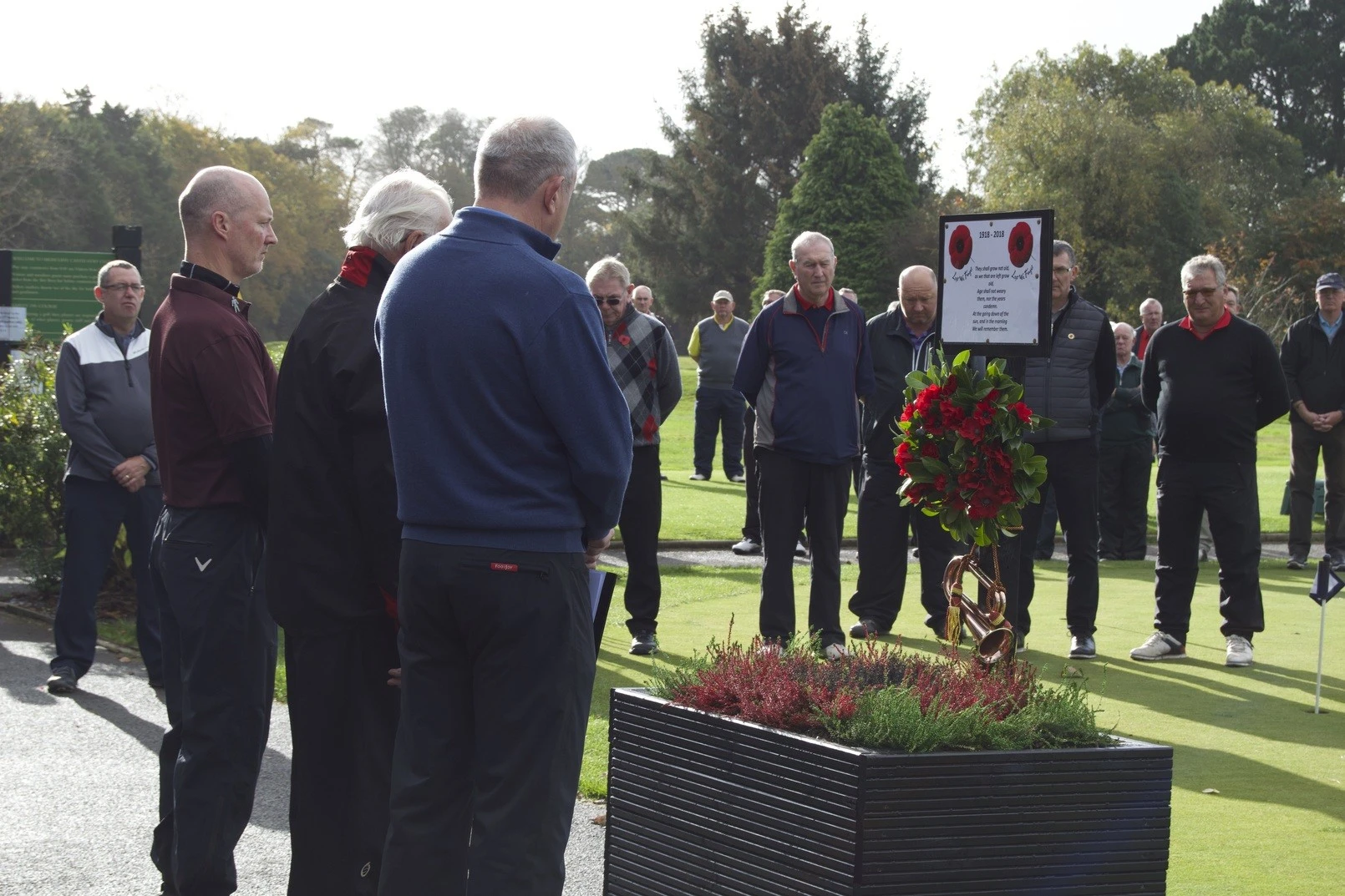 Players observing the two minute silence at Poppy Golf