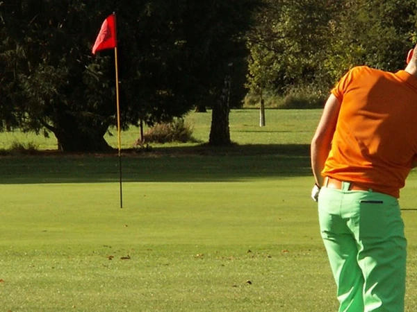 Golfer playing Poppy Golf on golf course