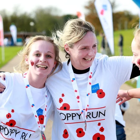 Poppy Run runners from Military Kids Club wearing medals