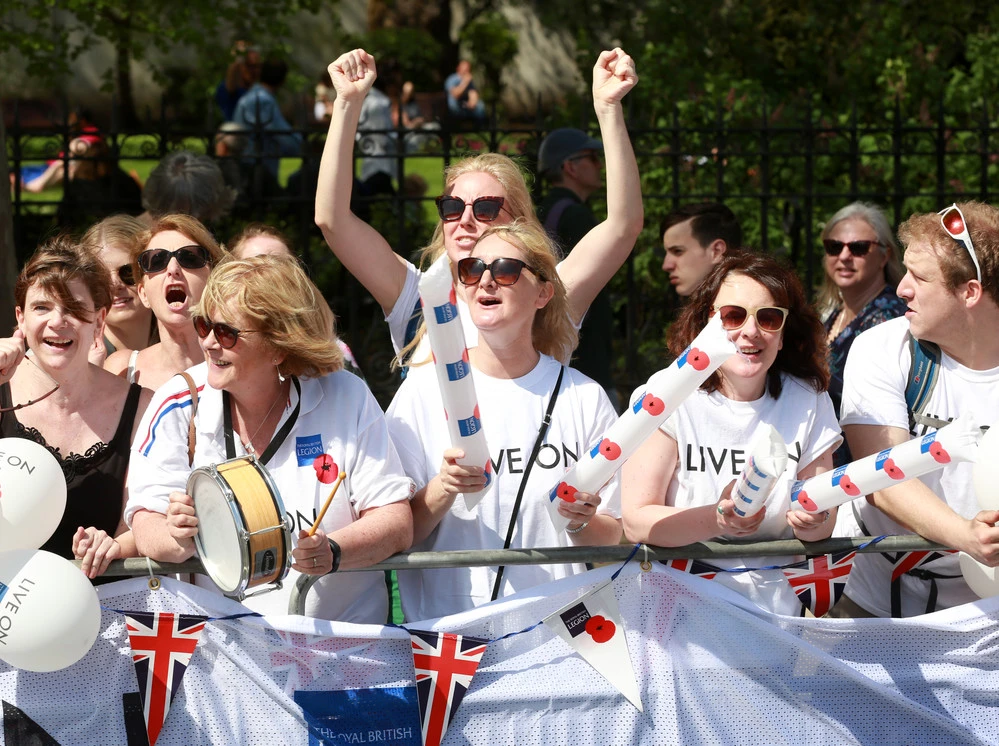 A group of event volunteers cheering 