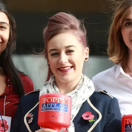 Three female Poppy Appeal Collectors
