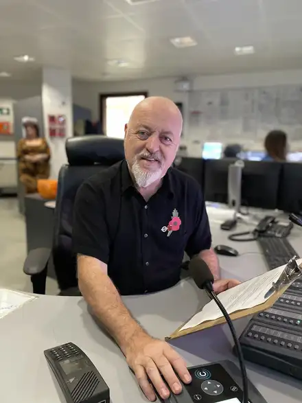 Bill Bailey sporting Poppy at work desk Bill Bailey sporting Poppy at work desk