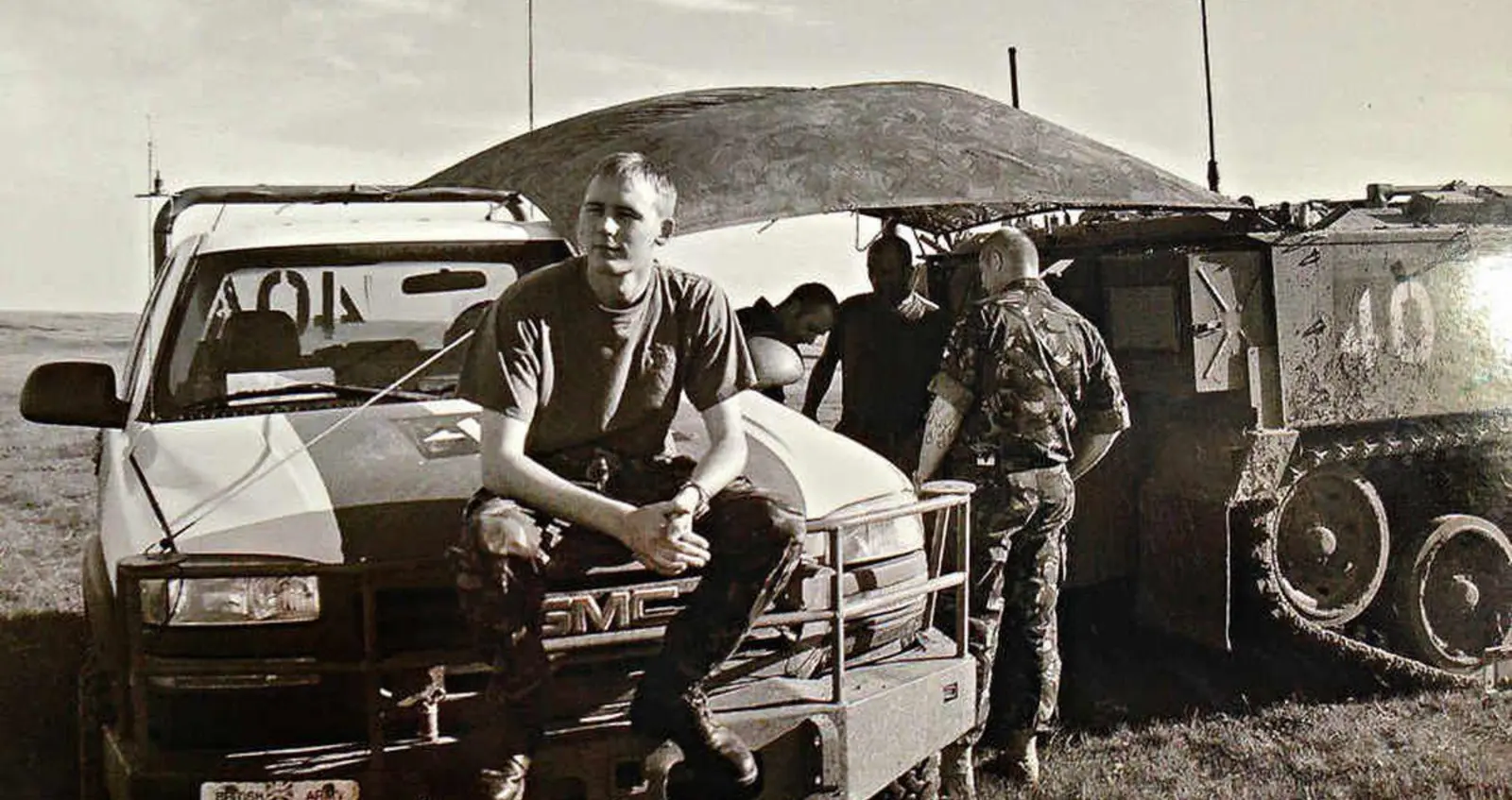 Dean Rathbone2 Dean Rathbone sitting on car