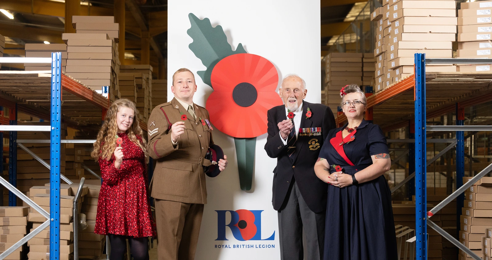 Group of four people holding plastic-free poppies