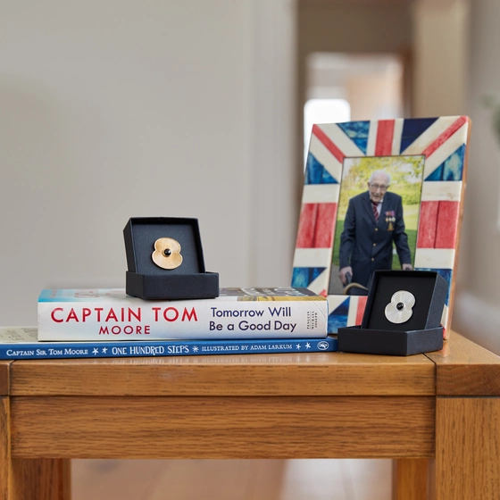 Poppy Shop Captain Tom Framed photo of Captain Tom alongside poppy pins
